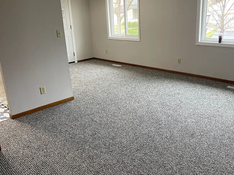 Living room with brand new carpet and paint!