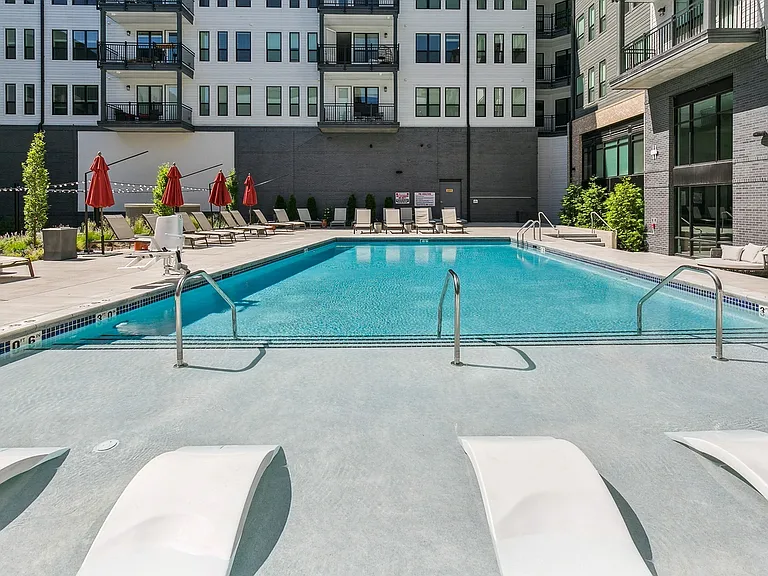 Soak up the sun or take a refreshing dip in this spacious, resort-inspired pool oasis.