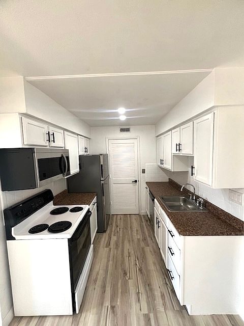 Dishwasher, stove, microwave, fridge and lots of cabinet space...with pantry!