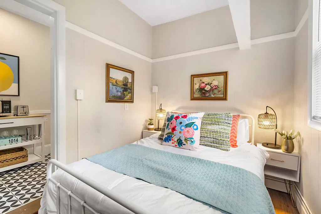 This second bedroom is a cozy space with a cottage-like feel