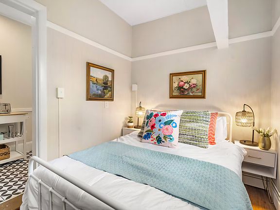 This second bedroom is a cozy space with a cottage-like feel