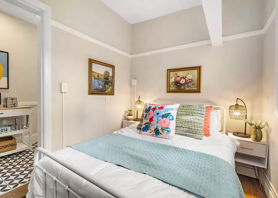 This second bedroom is a cozy space with a cottage-like feel