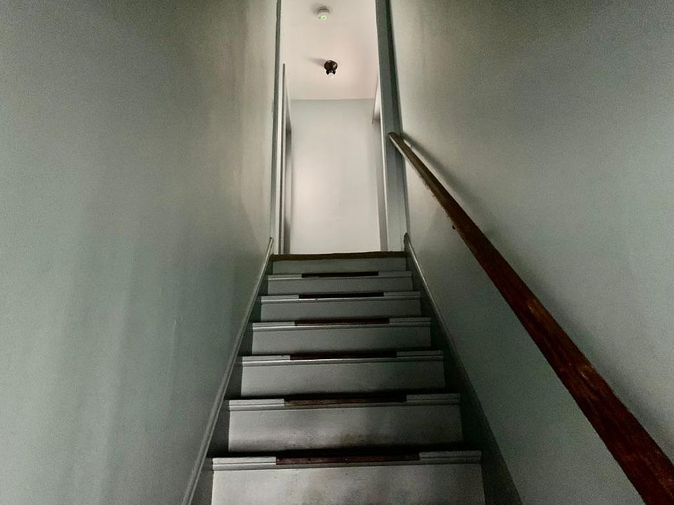 Interior stairs. Rental unit is on the left.