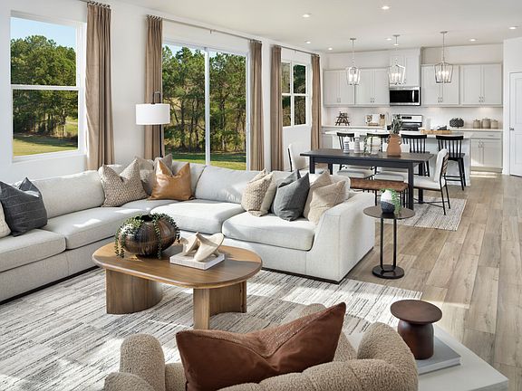 Sequoia model great room, dining area and kitchen.