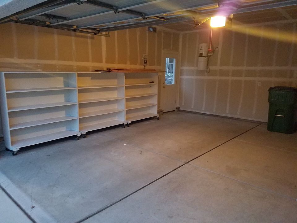 3 car garage with shelves