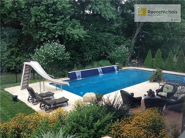 Gunite pool with fountain feature.