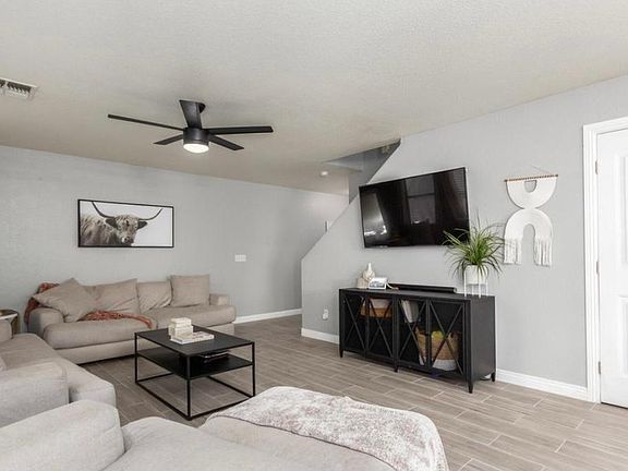 Living room with view of pantry door.