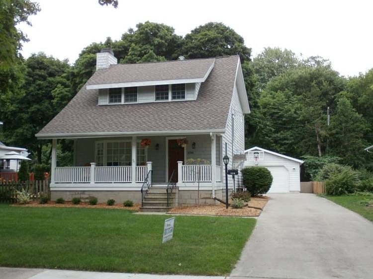 It's time to make your move to the Historical Area and take advantage of everything great about living within walking distance of downtown, the railtrail, the library and Dow Gardens.  This beautifully restored home captures the charm of a bygone era, but yet has been updated to a modern style.  Features include 4 bedrooms with a main floor master, updated kitchen, baths, windows, roof, sprinkler system, 2.5 detached garage, fenced yard that surrounds one of the largest yards in downtown area.  Call for your personal showing today.