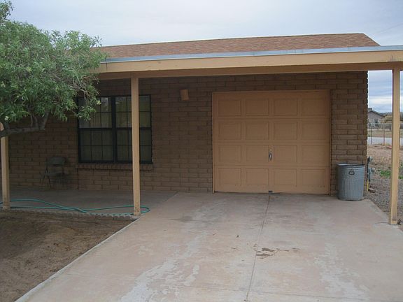 Single car garage with porched entrance