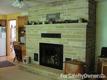Family room
						:
						Stone Fireplace with Gas Log insert.