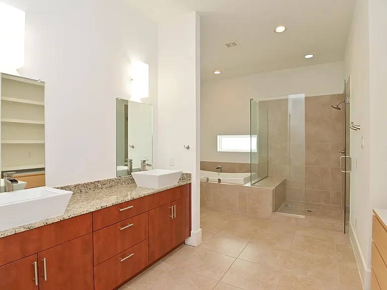 Huge master en suite on 3rd floor with soaker tub for 2, large shower, 2 large walk in closets, double sinks, and lots of storage space.