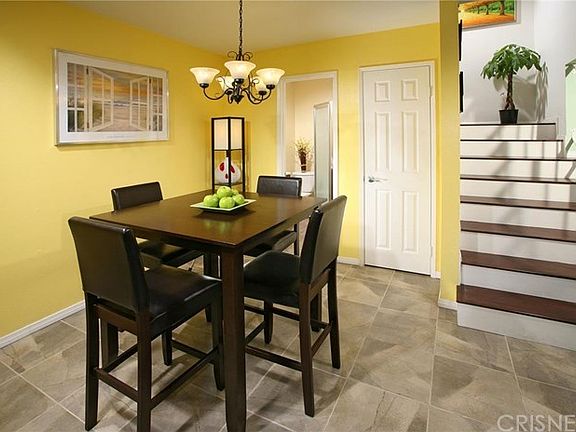 The stunning formal dining area fittingly adjoins the kitchen and with its stylish chandelier and el