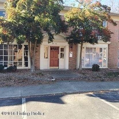 CONDO BUILDING FRONT ALSO SHOWING SIDEWALK & PAVED, OFF STREET, ASSIGNED PARKING