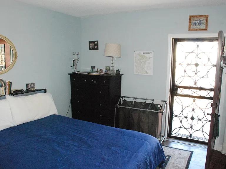 Security screen door allows for fresh air while one slumbers from May to September. Leads to spacious 12'x12' raised deck, which allows access to back yard and included private garage. Unit 2 has same config & "mini balcony."