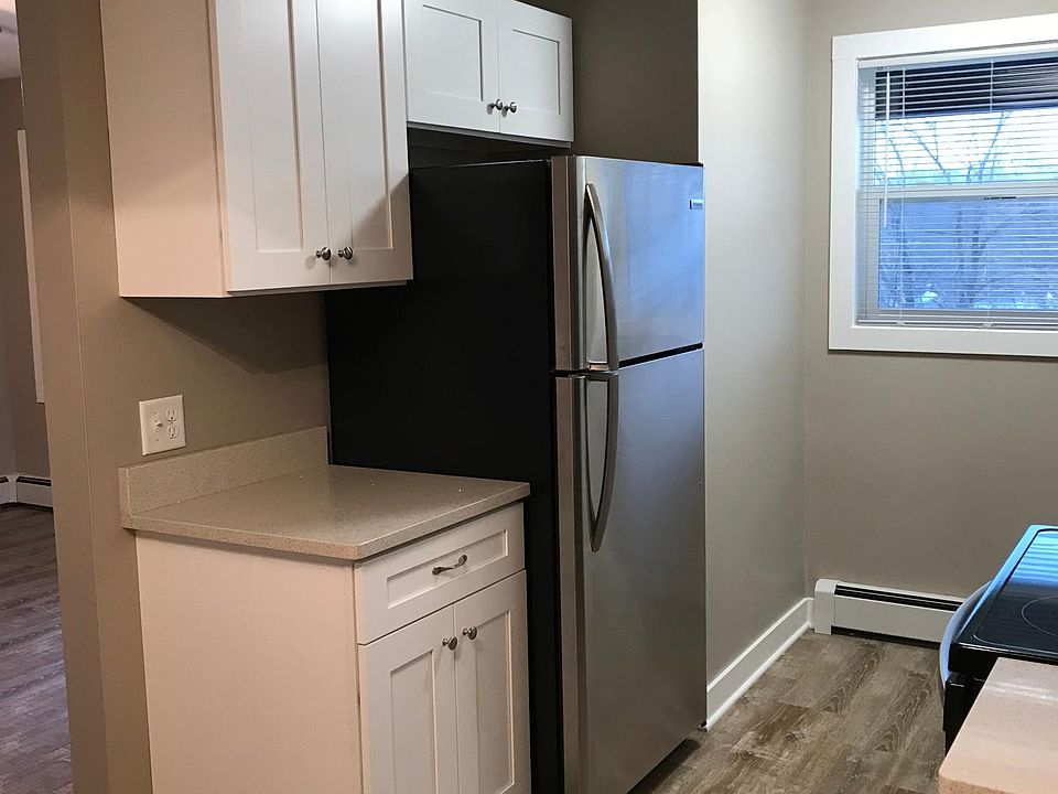Additional counter space located next to the fridge.