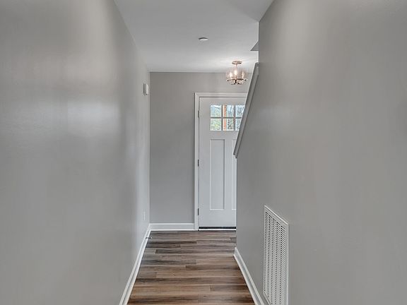 The area from front door to the living room, offering privacy at your entry.