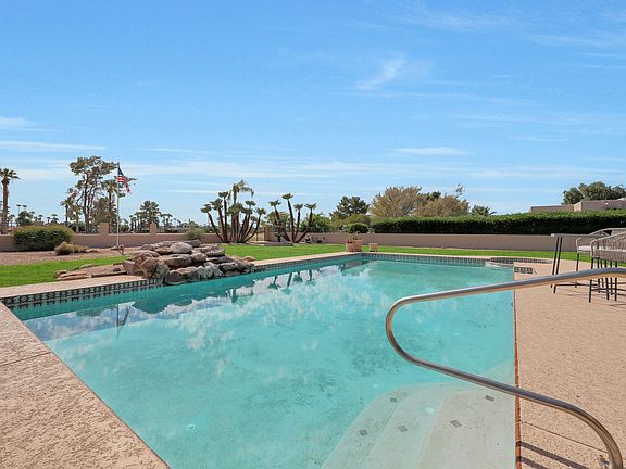 Large Pool with lush grass yard