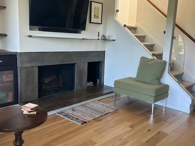Wood burning fireplace and 55" Smart TV with soundbar