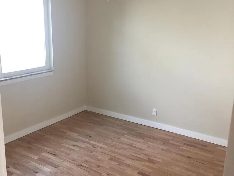 Bedrooms with ceiling fan and hardwood floors, and granite w