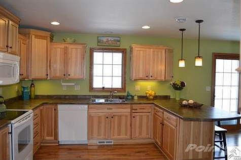 Hickory cabinets, pantry and adjacent mud room / half bath / laundry