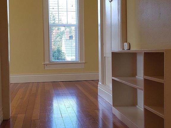 View down hallway into living/dining area