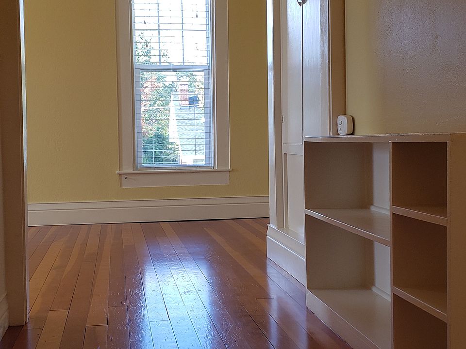 View down hallway into living/dining area
