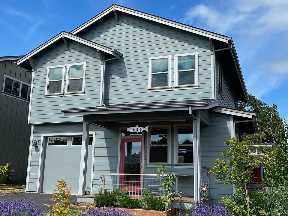 Front porch looks into a green space.