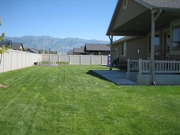 Fenced back yard, covered patio and exterior basement access.
