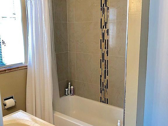 Bathroom with tub and shower