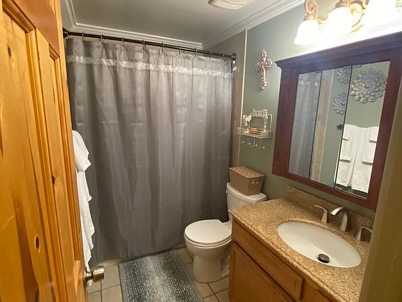 Unit A bathroom. Includes combined tub and shower.