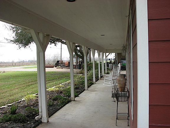 Rock the evening away on this large front porch that spans the length of the house. Low maintenance 
