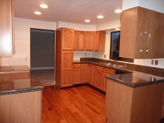 Large Designer Kitchen with Granite Counters.
