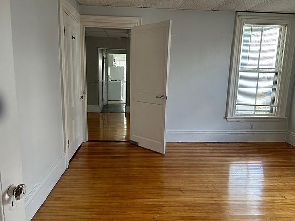 Bedroom can fit a 2 seater couch and a Tv on wall across next to door.