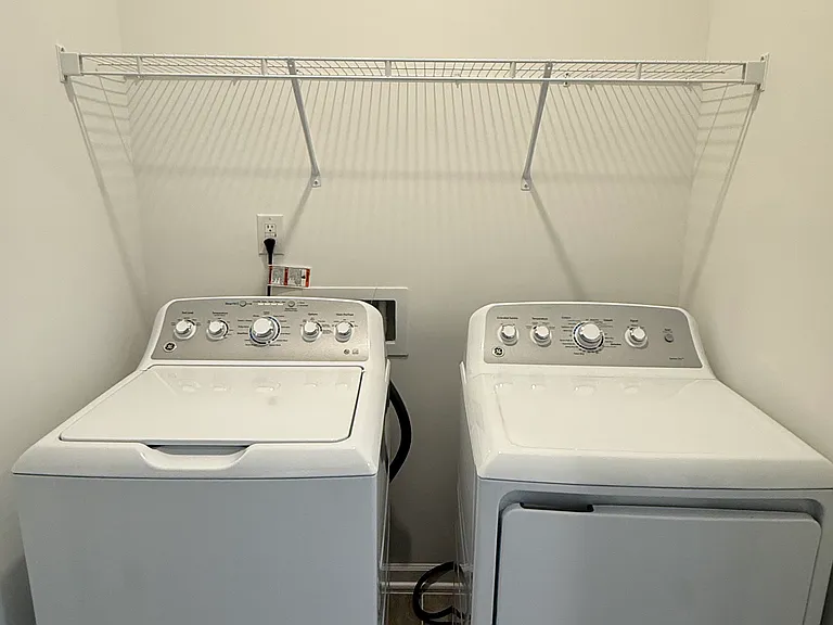 Dedicated laundry room with full-size washer and dryer included.