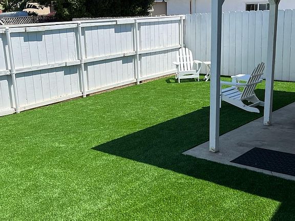 Back yard is private and exclusive to this unit (not shared). Includes artificial turf.