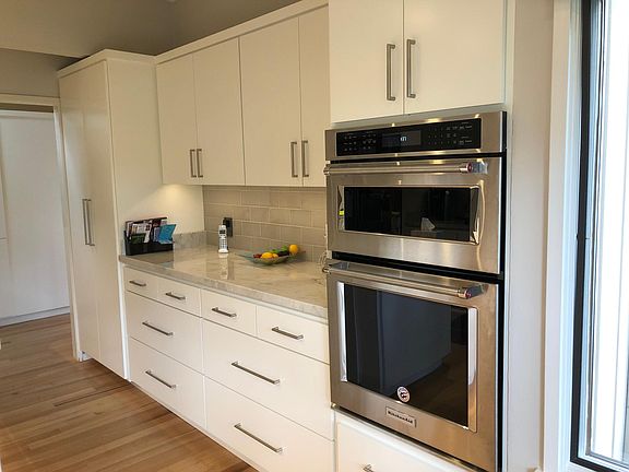 Kitchen pantry, storage drawers, microwave and oven