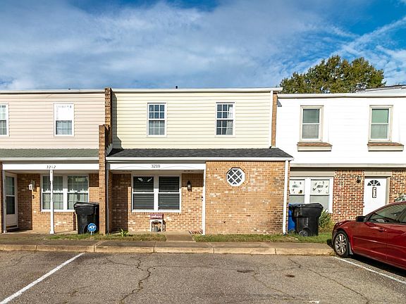 Front of the house with 2 parking spots
