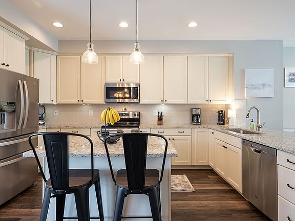 Kitchen: Granite, Maple cabinets, Island, Breakfast bar, Dishwasher, Disposal, Eat-In, Recessed-lights, Refrigerator, Electric range, Microwave, Pantry.