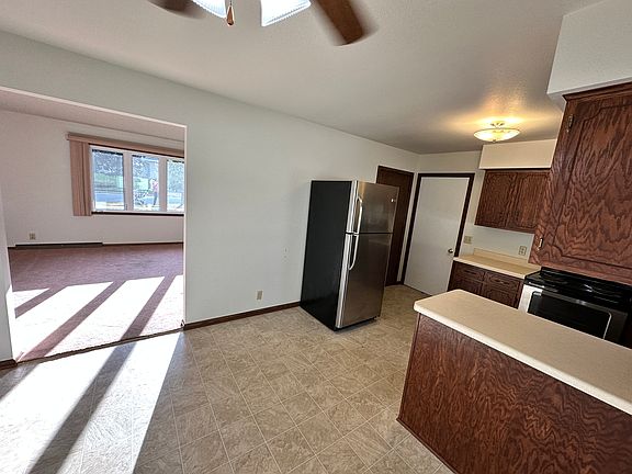 View from the dining room into the kitchen and living room