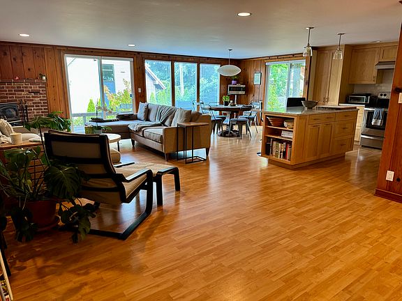Living area looking towards open kitchen and dining area.