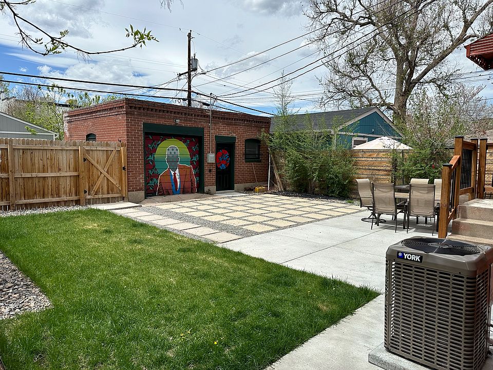 Fully landscaped backyard, shared with two other units on the property