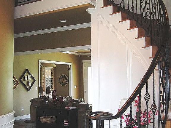 Spiral staircase in Entryway.
