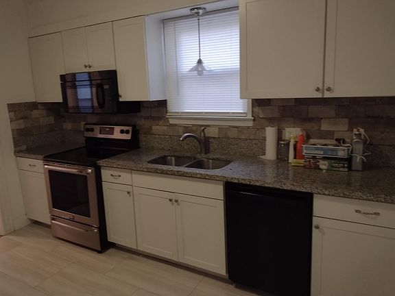 Nice shaker style white cabinets with beautiful Granite Counter tops Newer appliances