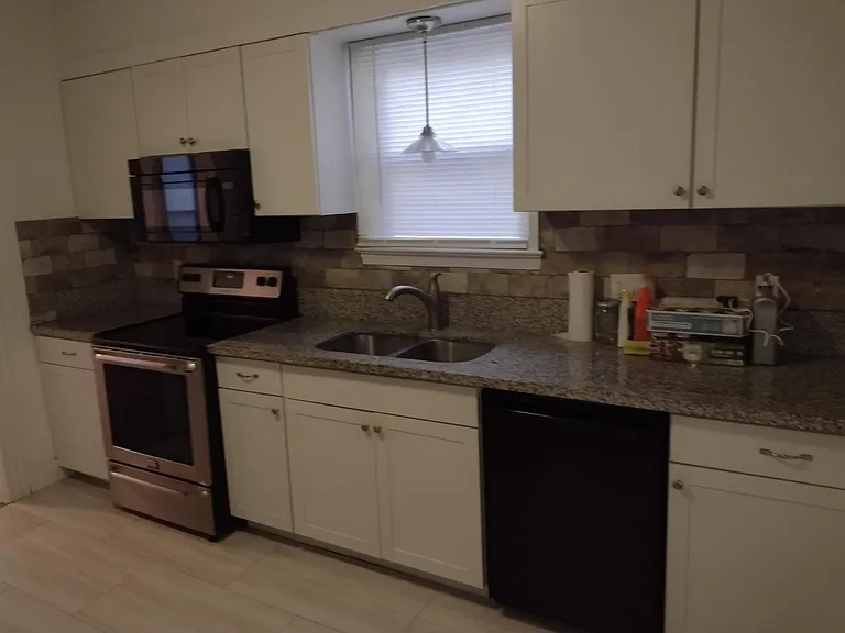 Nice shaker style white cabinets with beautiful Granite Counter tops Newer appliances