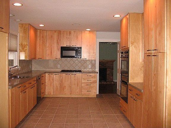 Renovated kitchen with Thermador gas cooktop, mapble cabinets...