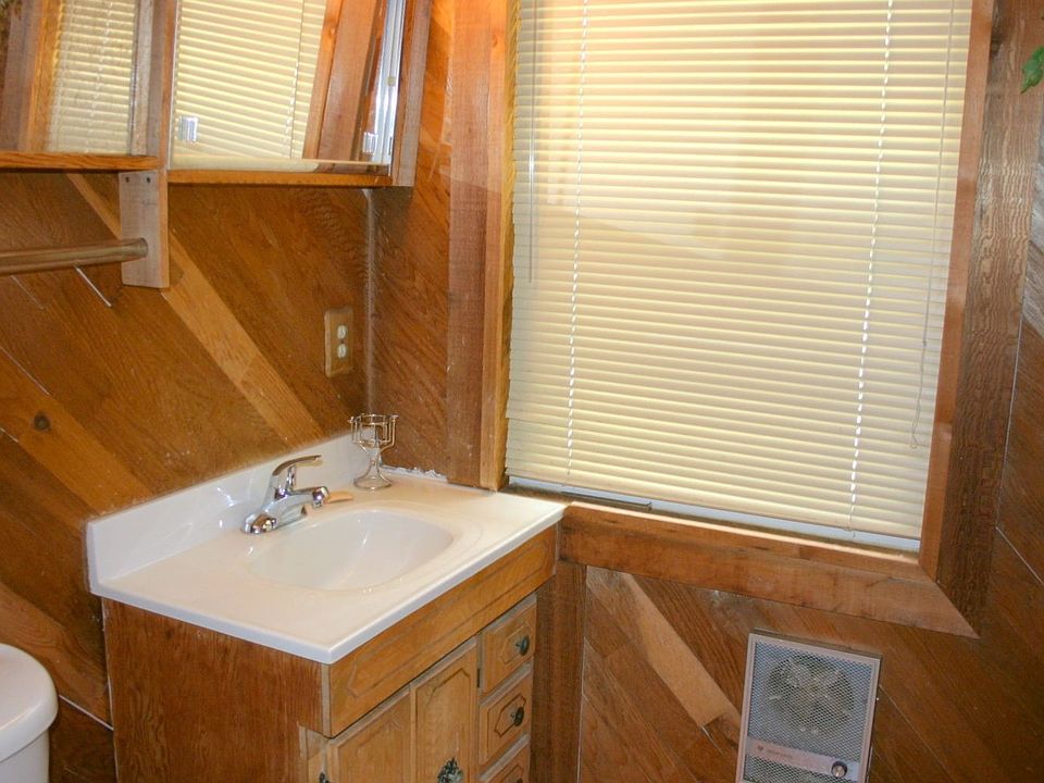 This full bathroom with walk-in shower was added with the garage conversion.