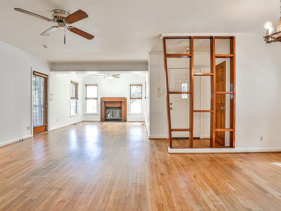 living and dining, fireplace and door to screen porch