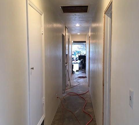 Hallway, new wood floors on the way. 