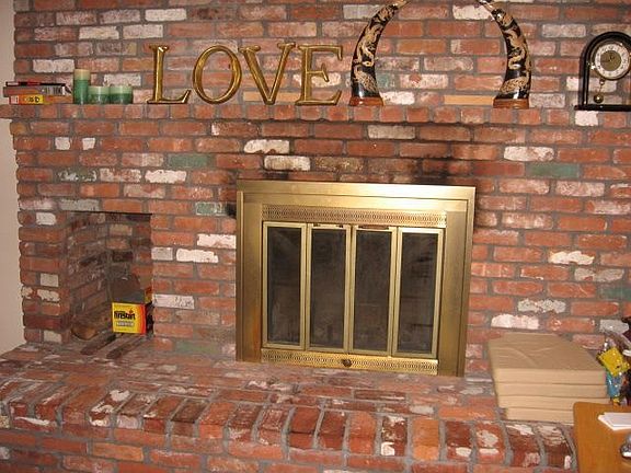 brick fireplace in family room