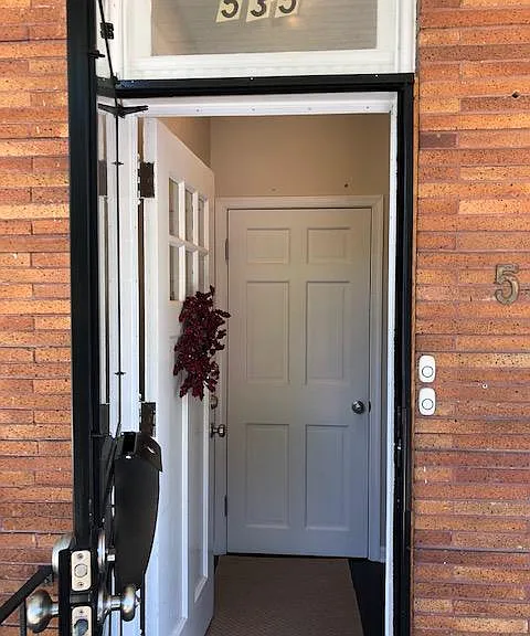 front door and foyer to basement unit